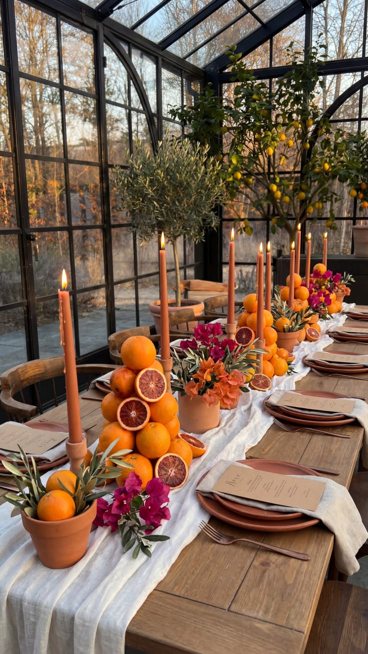 Citrus and candle tablescape in a greenhouse