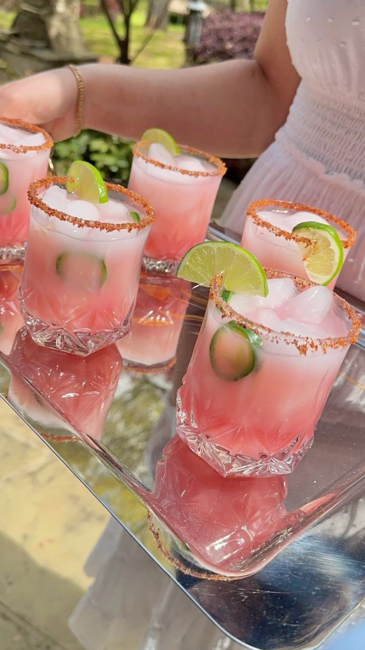 Pink cocktails passed on a silver tray
