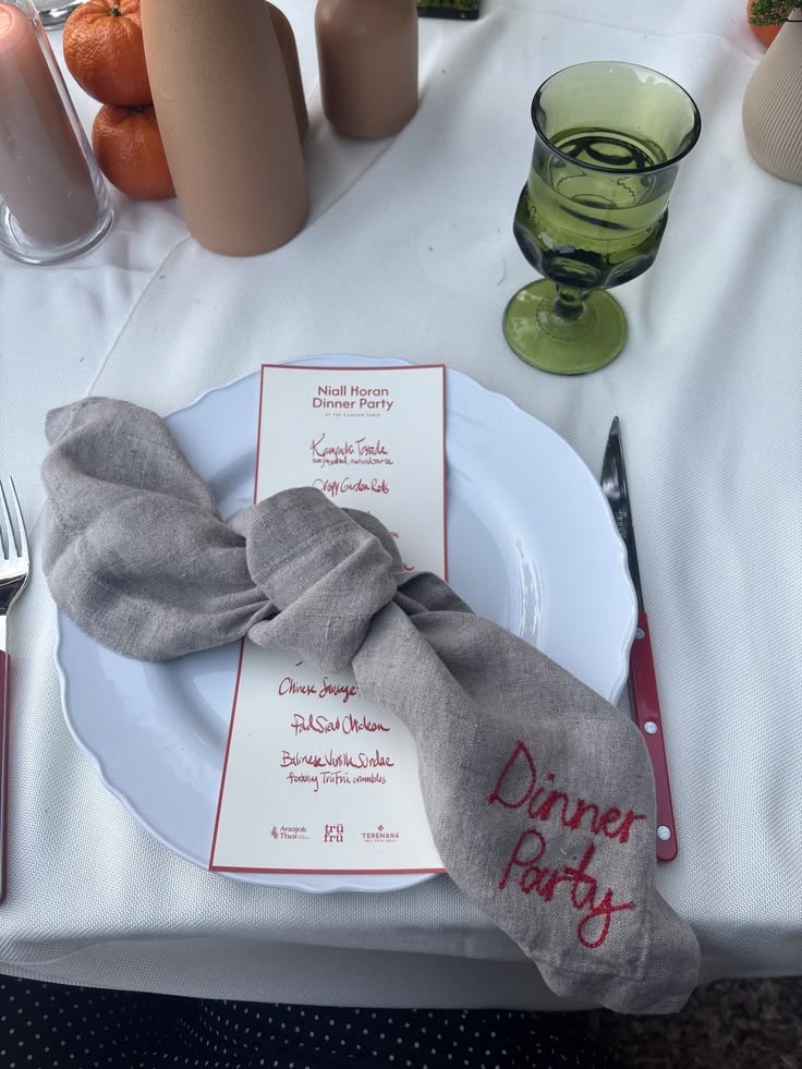 Linen napkin embroidered with the words dinner party