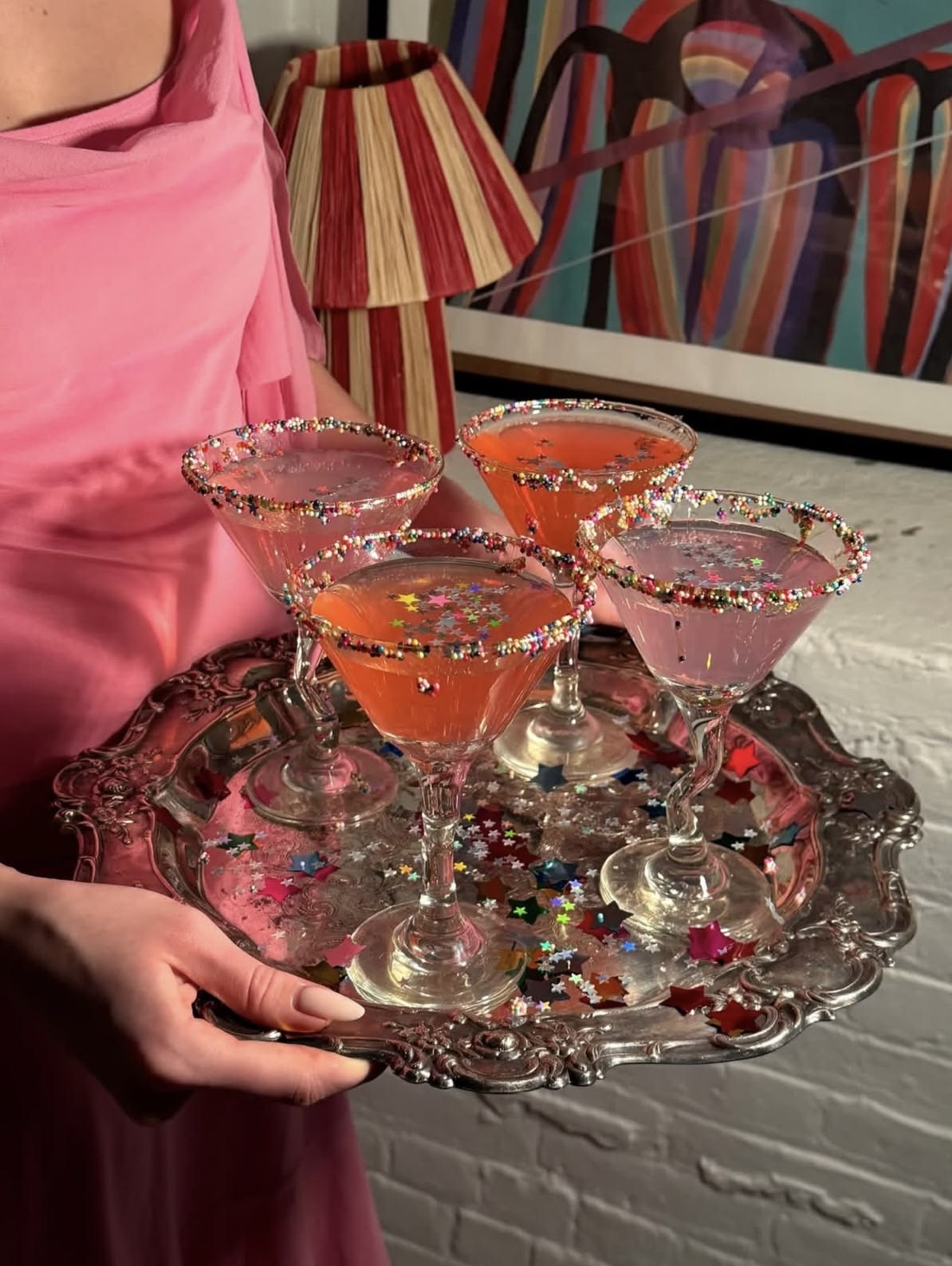 Confetti-rimmed martinis on a silver tray